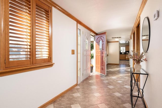 hallway featuring crown molding