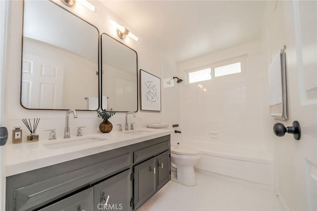 full bathroom with bathing tub / shower combination, vanity, and toilet