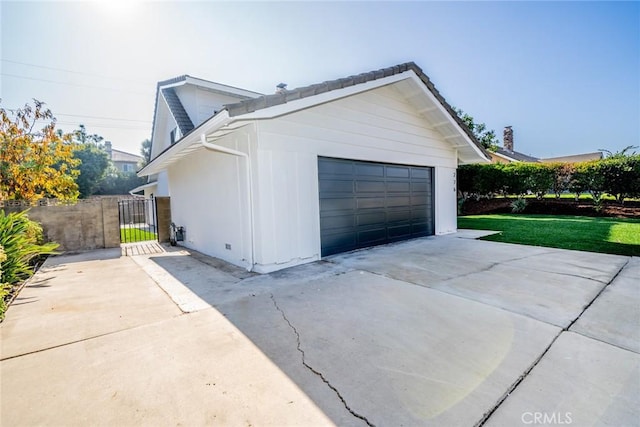 garage featuring a yard