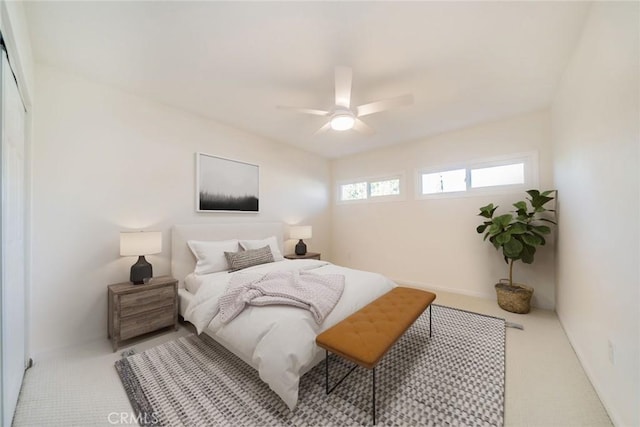 bedroom featuring ceiling fan and light colored carpet