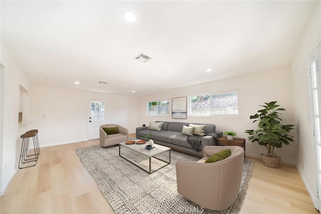 living room with light hardwood / wood-style floors