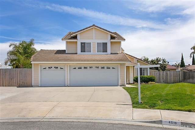 front facade featuring a garage and a front lawn