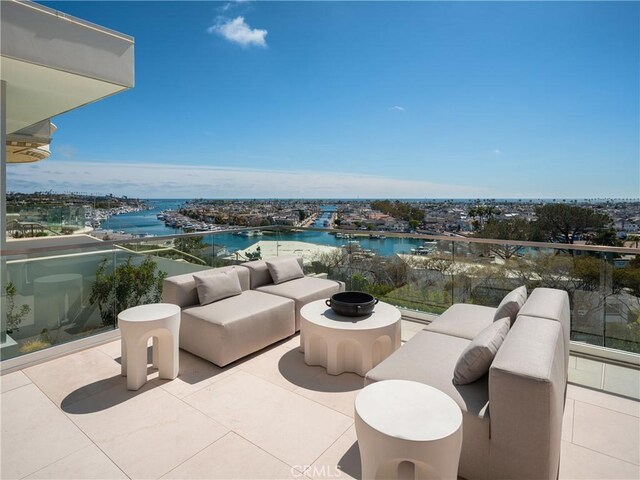 exterior space with an outdoor hangout area and a water view