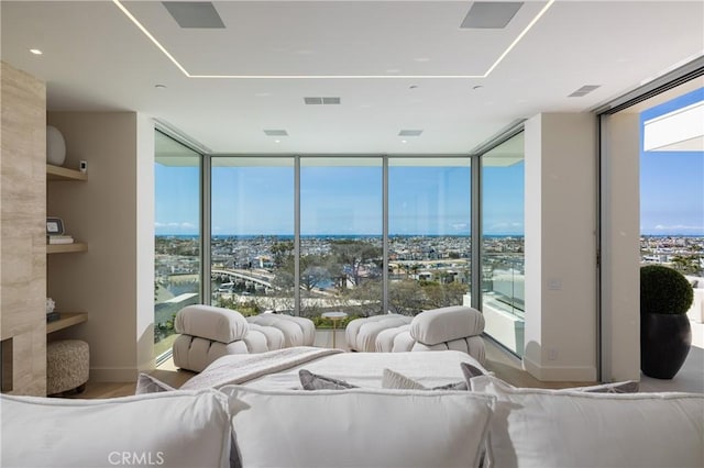 sunroom / solarium with a water view and plenty of natural light