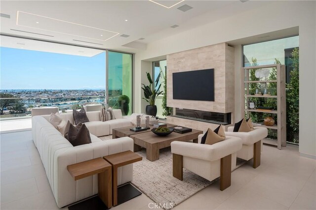 living room with expansive windows and a wealth of natural light