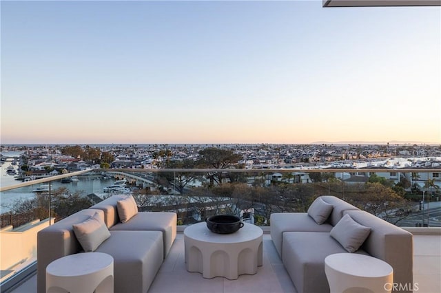 balcony at dusk with outdoor lounge area