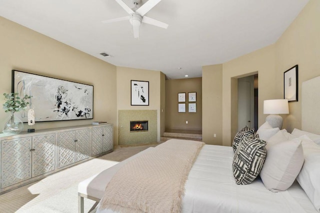 bedroom with light carpet and ceiling fan