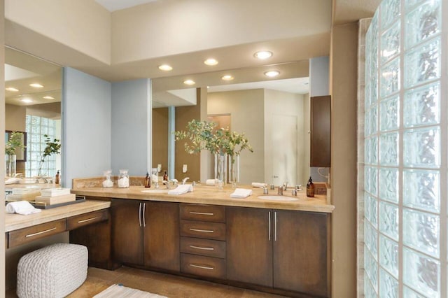 bathroom featuring tile patterned flooring and vanity