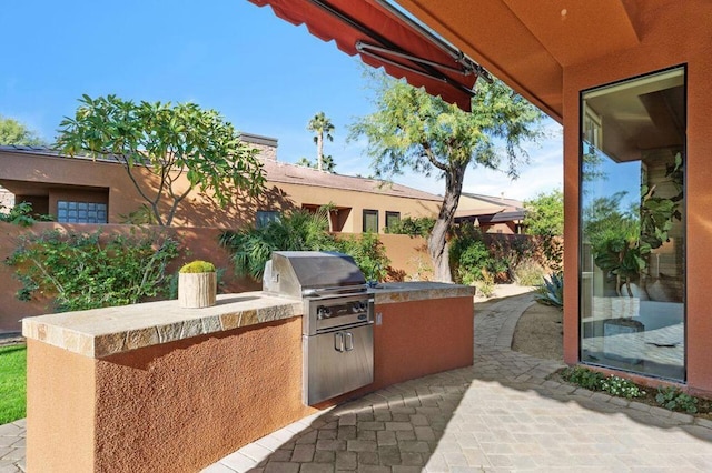 view of patio / terrace featuring area for grilling and exterior kitchen