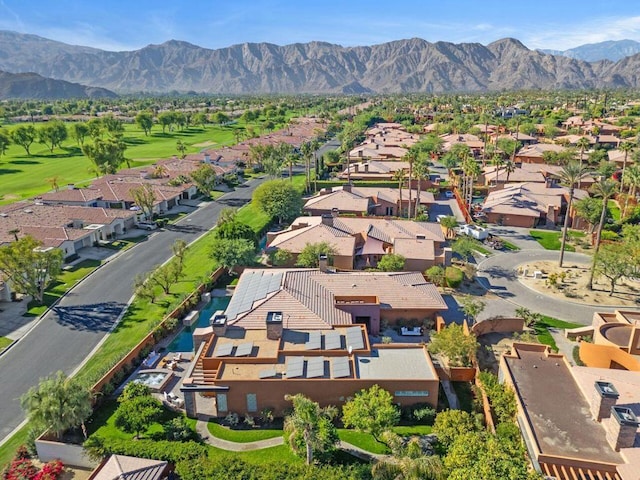 birds eye view of property with a mountain view