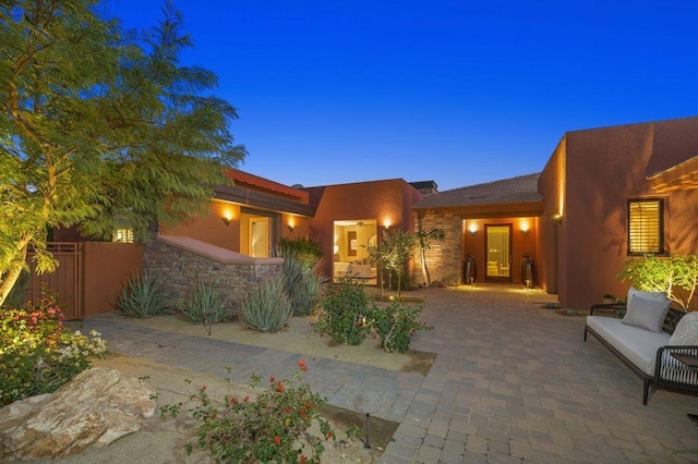 view of front of house with a patio area