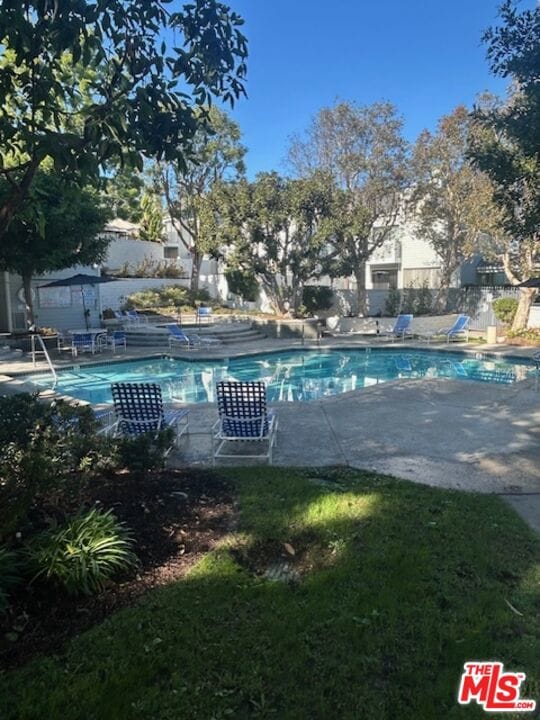 view of swimming pool featuring a patio