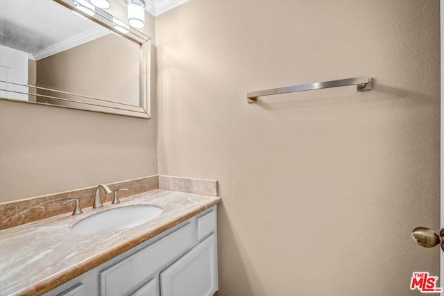 bathroom featuring vanity and crown molding