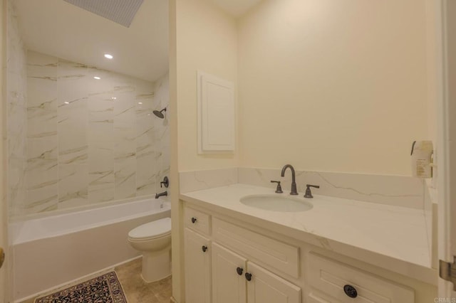 full bathroom featuring tiled shower / bath combo, vanity, and toilet