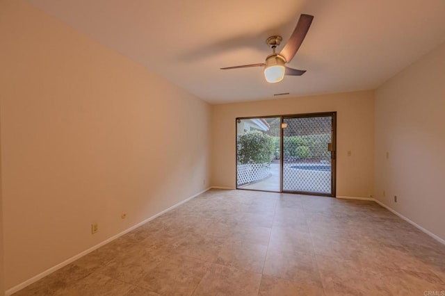 spare room with ceiling fan