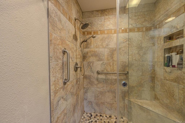 bathroom with a tile shower