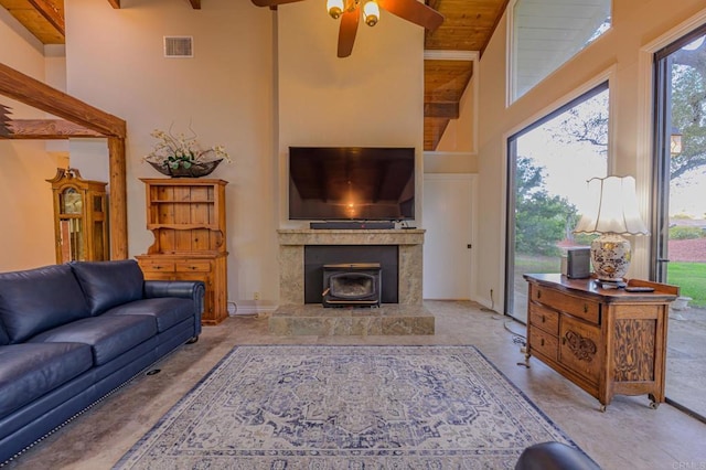 living room with ceiling fan, a towering ceiling, beam ceiling, and wooden ceiling