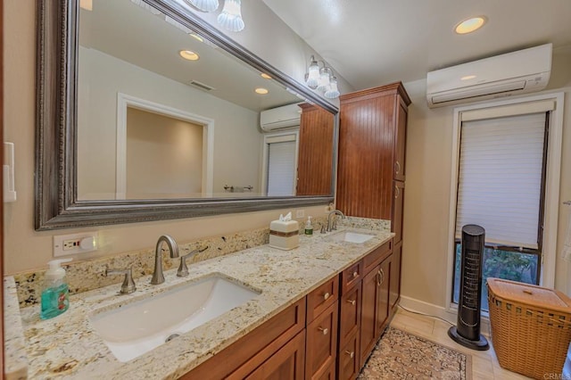 bathroom featuring vanity, an AC wall unit, and tile patterned floors