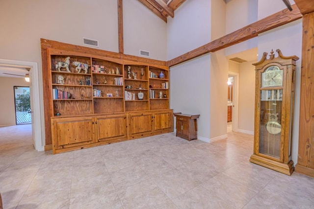 32202 Taupa Way, Pauma Valley, CA 92061 - unfurnished room with high vaulted ceiling, baseboards, light tile patterned floors, and beamed ceiling