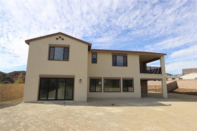 back of house with a patio