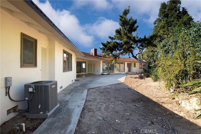 view of yard featuring central AC and a patio area