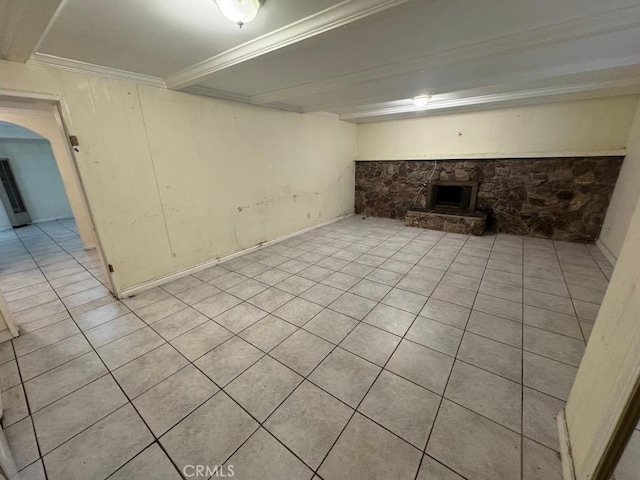 basement with light tile patterned flooring and ornamental molding