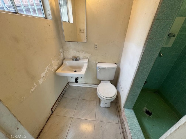 bathroom featuring tile patterned floors, sink, and toilet