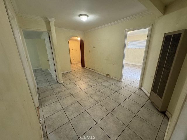 tiled spare room with ornamental molding