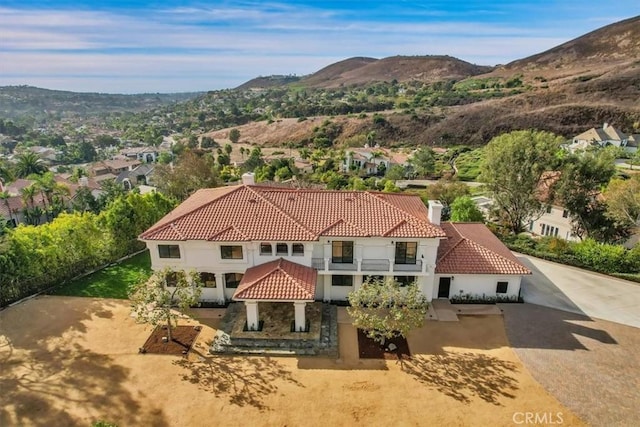 drone / aerial view featuring a mountain view