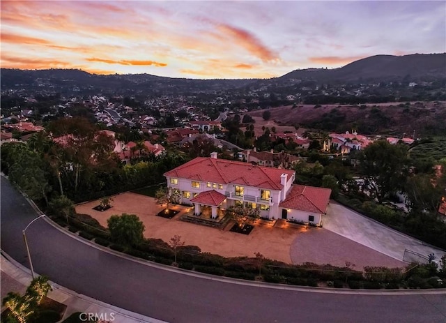 aerial view at dusk with a mountain view