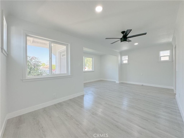 unfurnished room featuring light wood-type flooring and ceiling fan