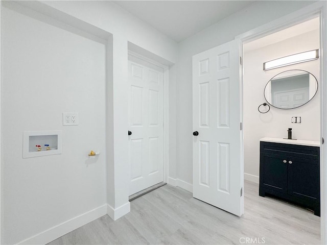 bathroom with vanity and wood-type flooring