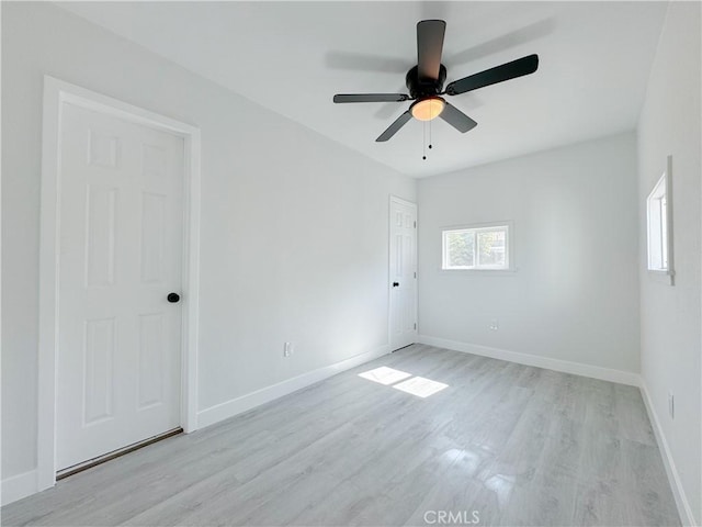 unfurnished room featuring ceiling fan and light hardwood / wood-style flooring