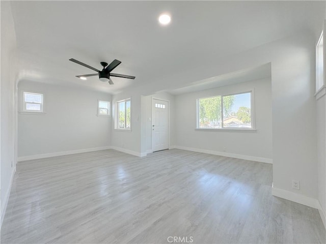 unfurnished room featuring ceiling fan and light hardwood / wood-style flooring