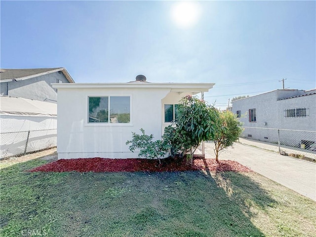 exterior space with a front lawn