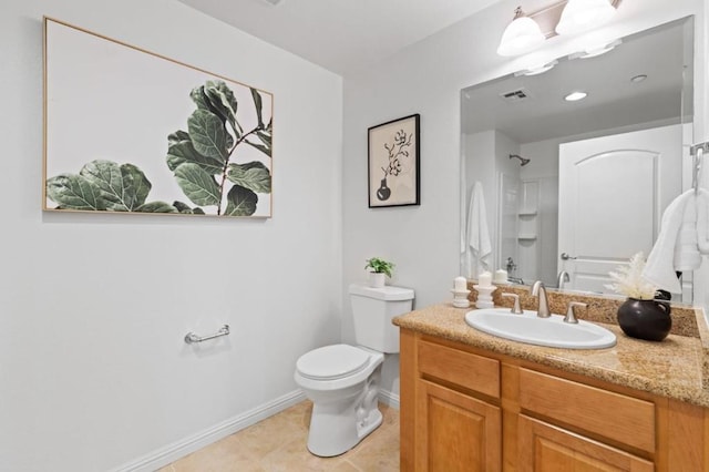 bathroom with vanity, tile patterned floors, toilet, and walk in shower