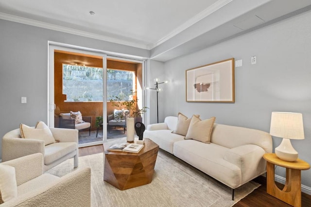 living room with ornamental molding and hardwood / wood-style floors