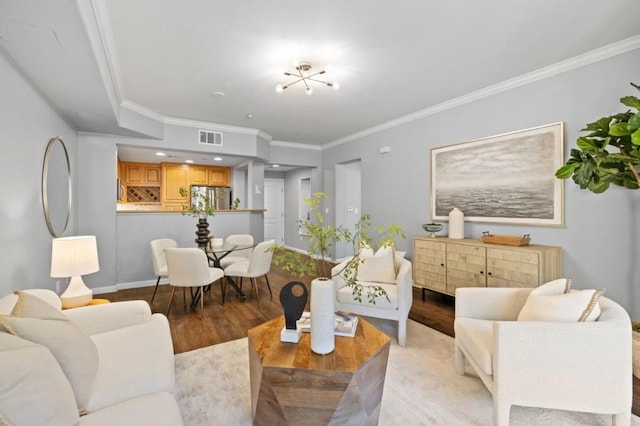 living room with crown molding and light wood-type flooring