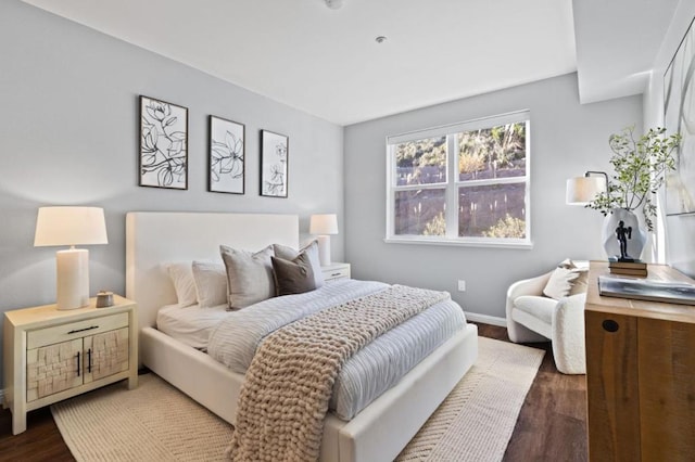 bedroom featuring dark hardwood / wood-style flooring