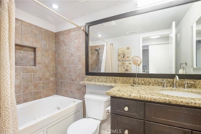 full bathroom with shower / bath combination with curtain, toilet, and vanity