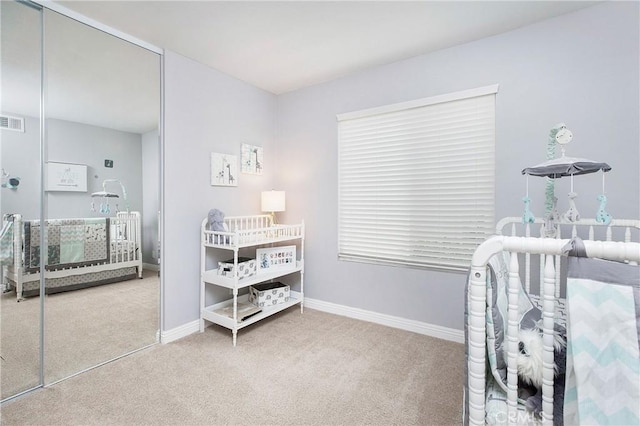 carpeted bedroom featuring a closet