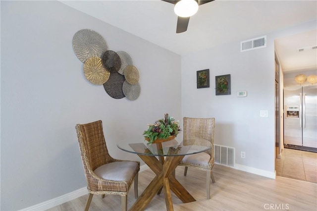 dining room featuring ceiling fan and light hardwood / wood-style flooring