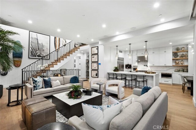 living room with light hardwood / wood-style flooring