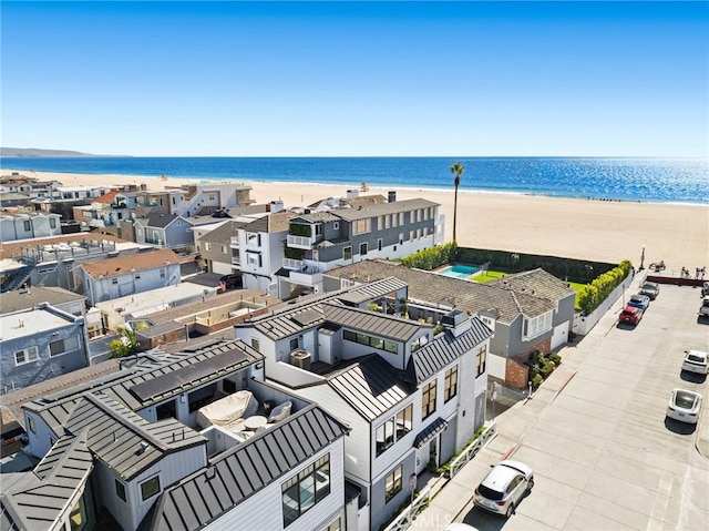 bird's eye view with a beach view and a water view