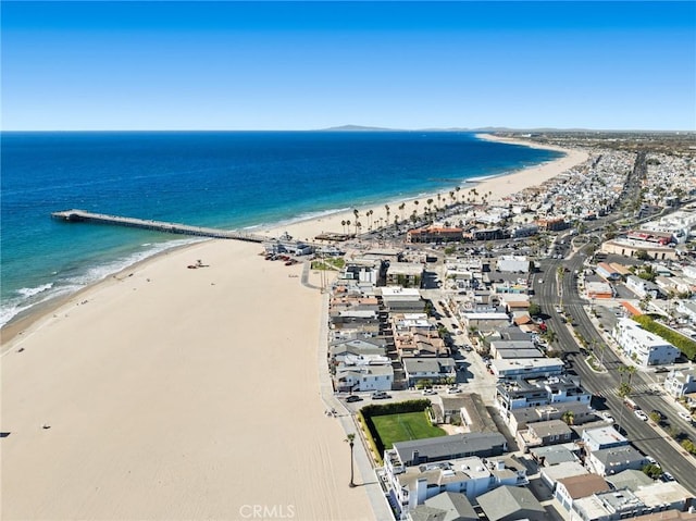 aerial view with a water view and a view of the beach