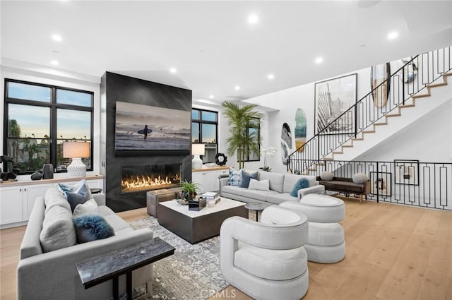 living room featuring a fireplace and light hardwood / wood-style floors