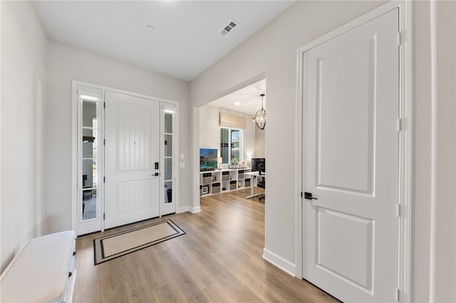 7631 Capstone Ct, Riverside, CA 92506 - foyer with light wood-type flooring and baseboards