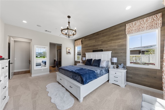 7631 Capstone Ct, Riverside, CA 92506 - bedroom with light colored carpet, wooden walls, a chandelier, baseboards, and recessed lighting