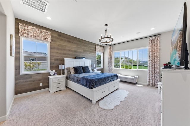 7631 Capstone Ct, Riverside, CA 92506 - bedroom with wooden walls, baseboards, a chandelier, recessed lighting, and light carpet