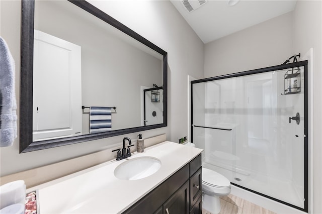 7631 Capstone Ct, Riverside, CA 92506 - bathroom with a shower stall, toilet, and vanity